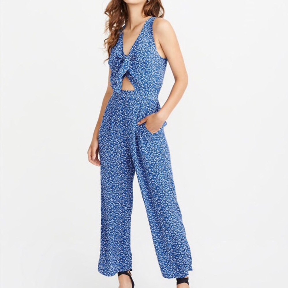 Knot front cut out blue floral jumpsuit